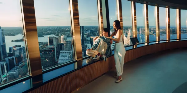 Couple relaxing at the windows on the observation deck