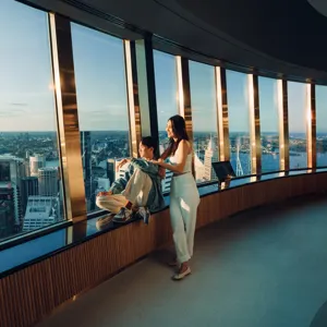 Couple relaxing at the windows on the observation deck